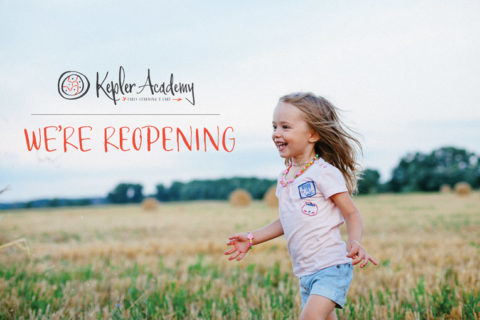 girl running through the grass